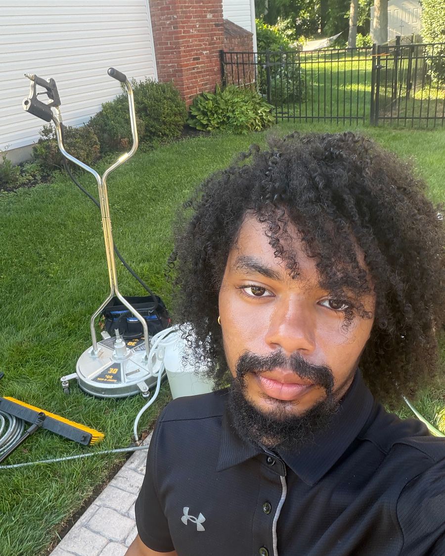 Juelz, who founded Regent Wash in May 2026, on a job with his surface cleaner and pressure washing gear