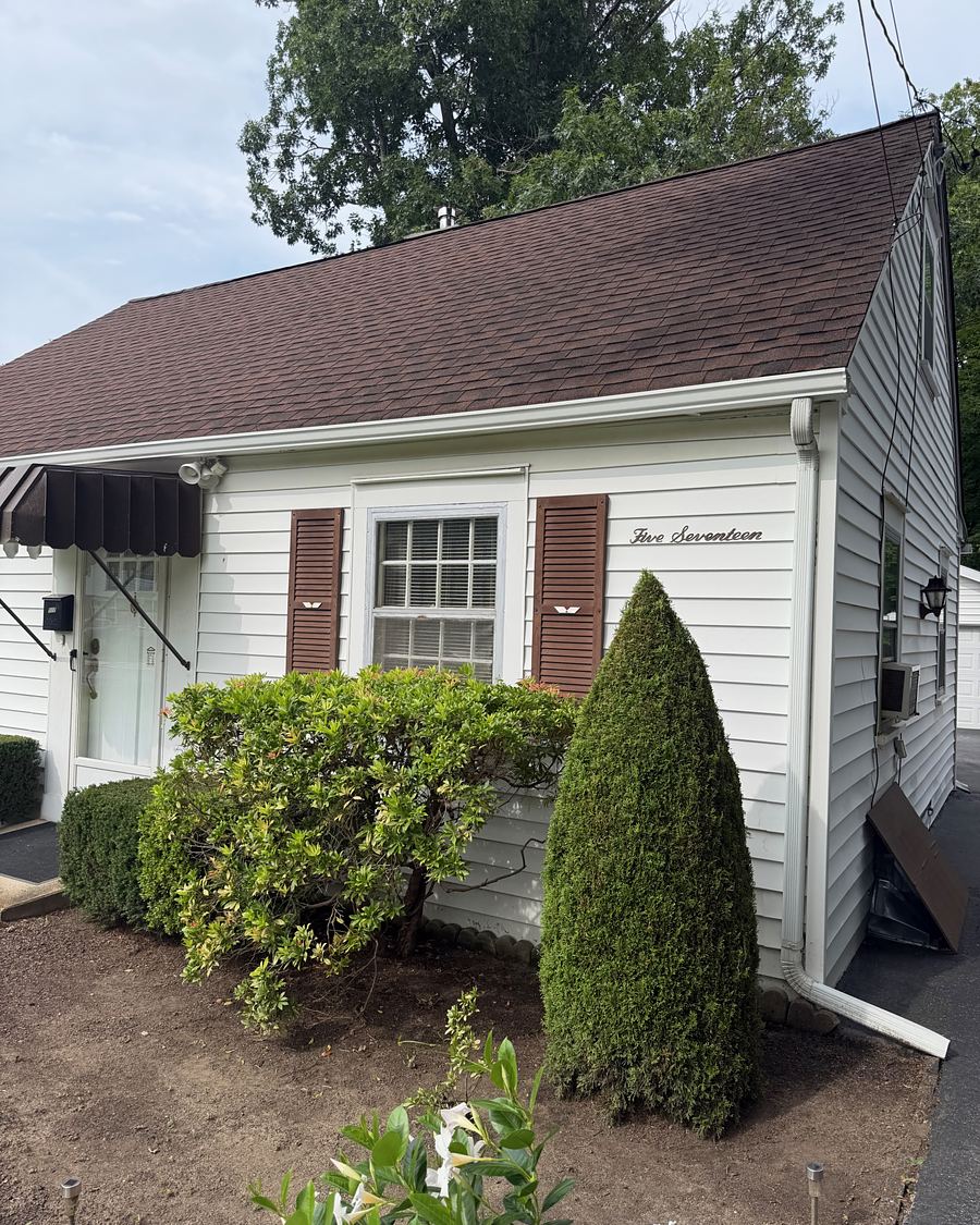 Full front of a white Havertown, PA cape after gutter brightening, gutter runs and downspout bright white