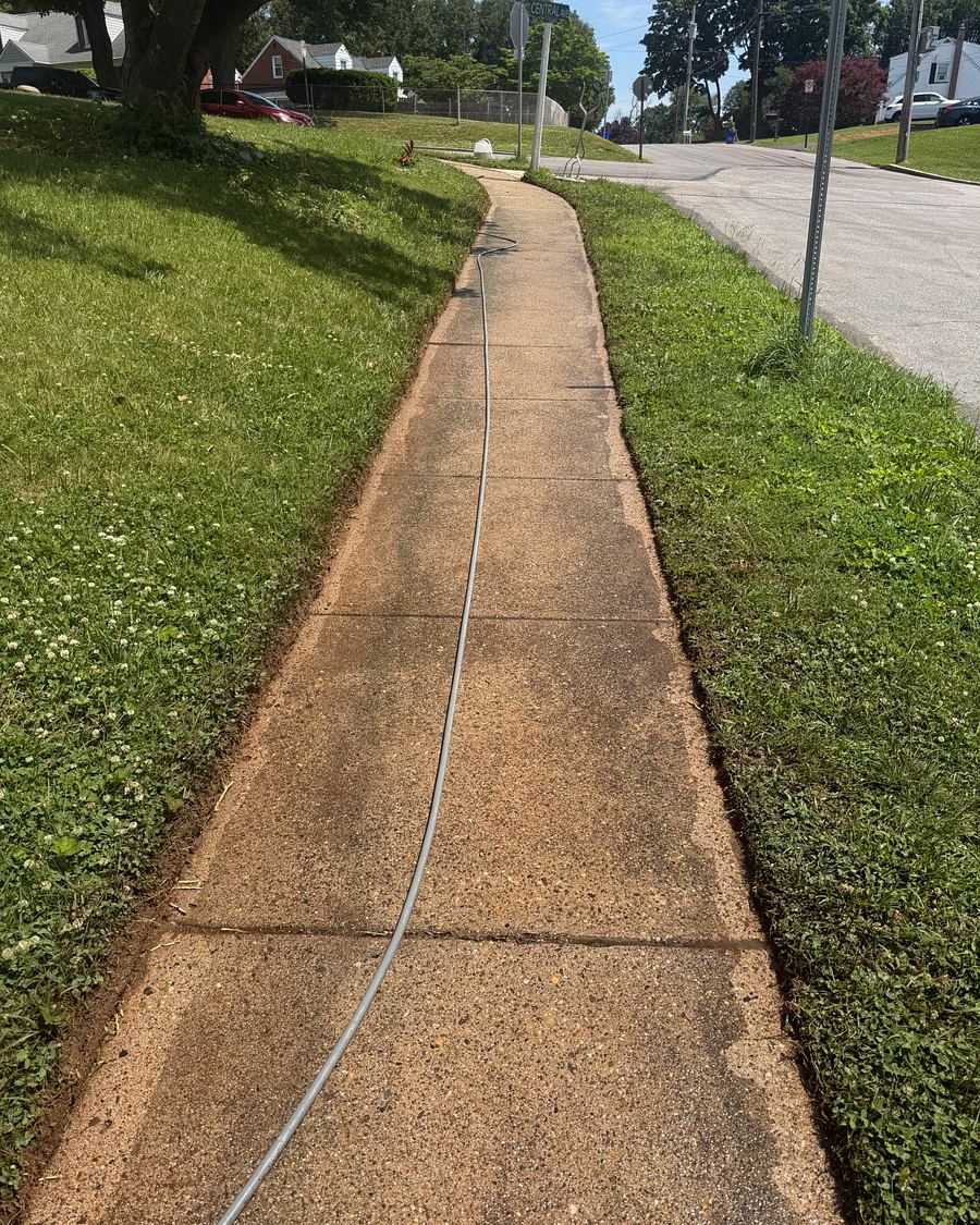 The same style of Havertown, PA front walkway before washing, stained an uneven tan and brown