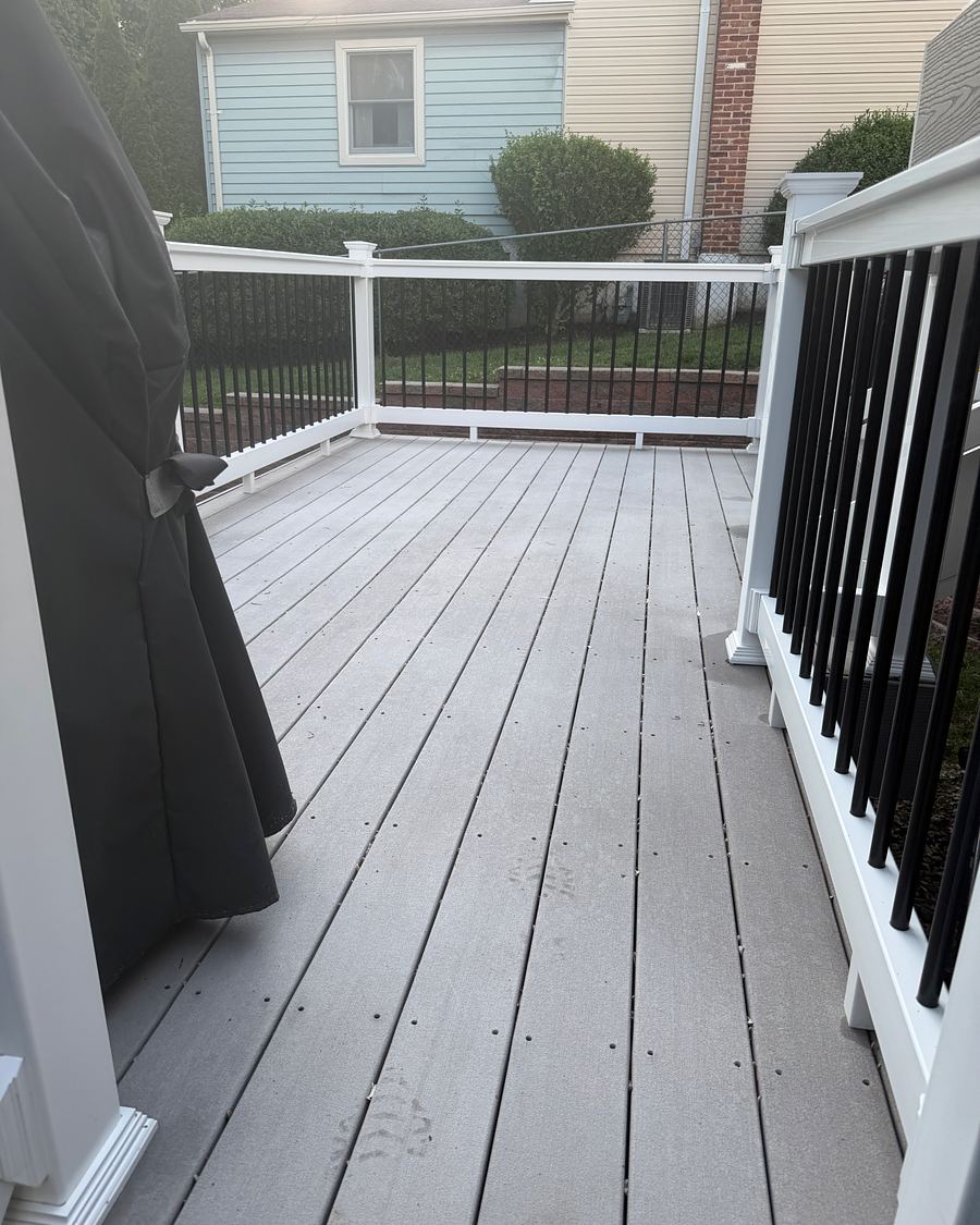 The same Havertown, PA composite deck after soft washing, the boards an even light gray