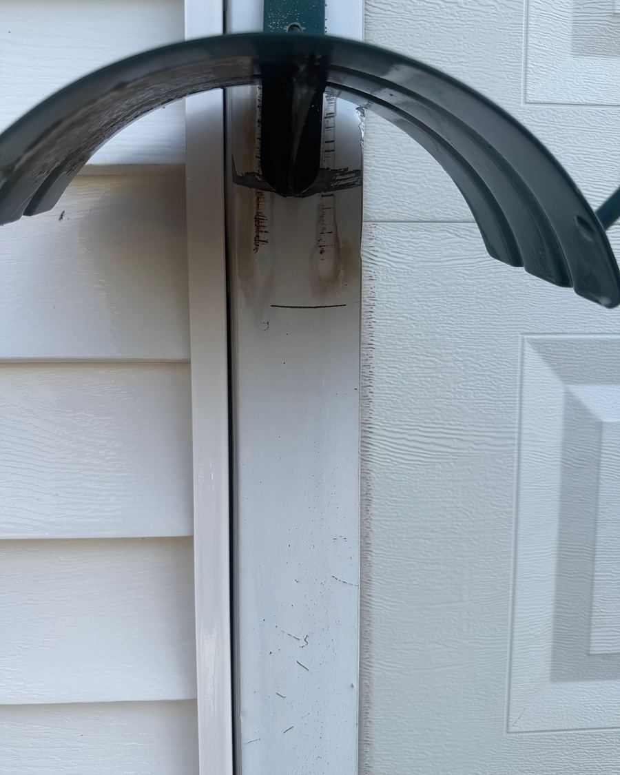 The same Hatboro, PA corner post after treatment, the orange rust streaks lifted off the vinyl