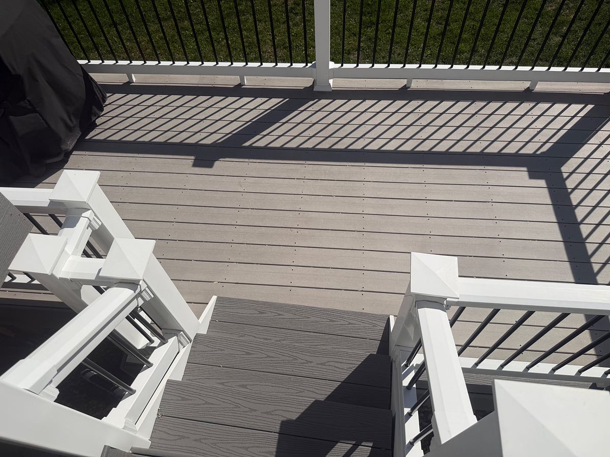 The same Havertown, PA composite deck and stairs after soft washing, the boards clean and even