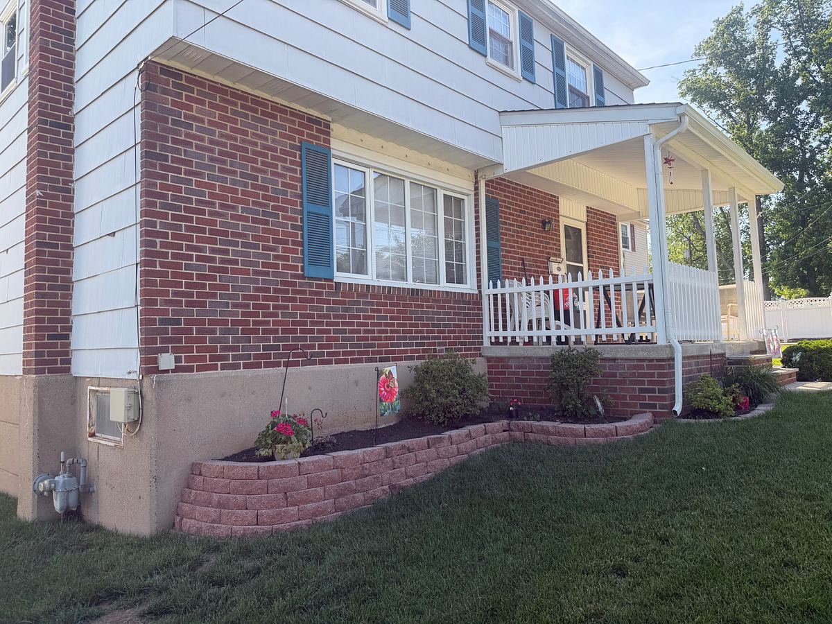 Brick front, garden wall and covered porch of a Havertown, PA home after washing